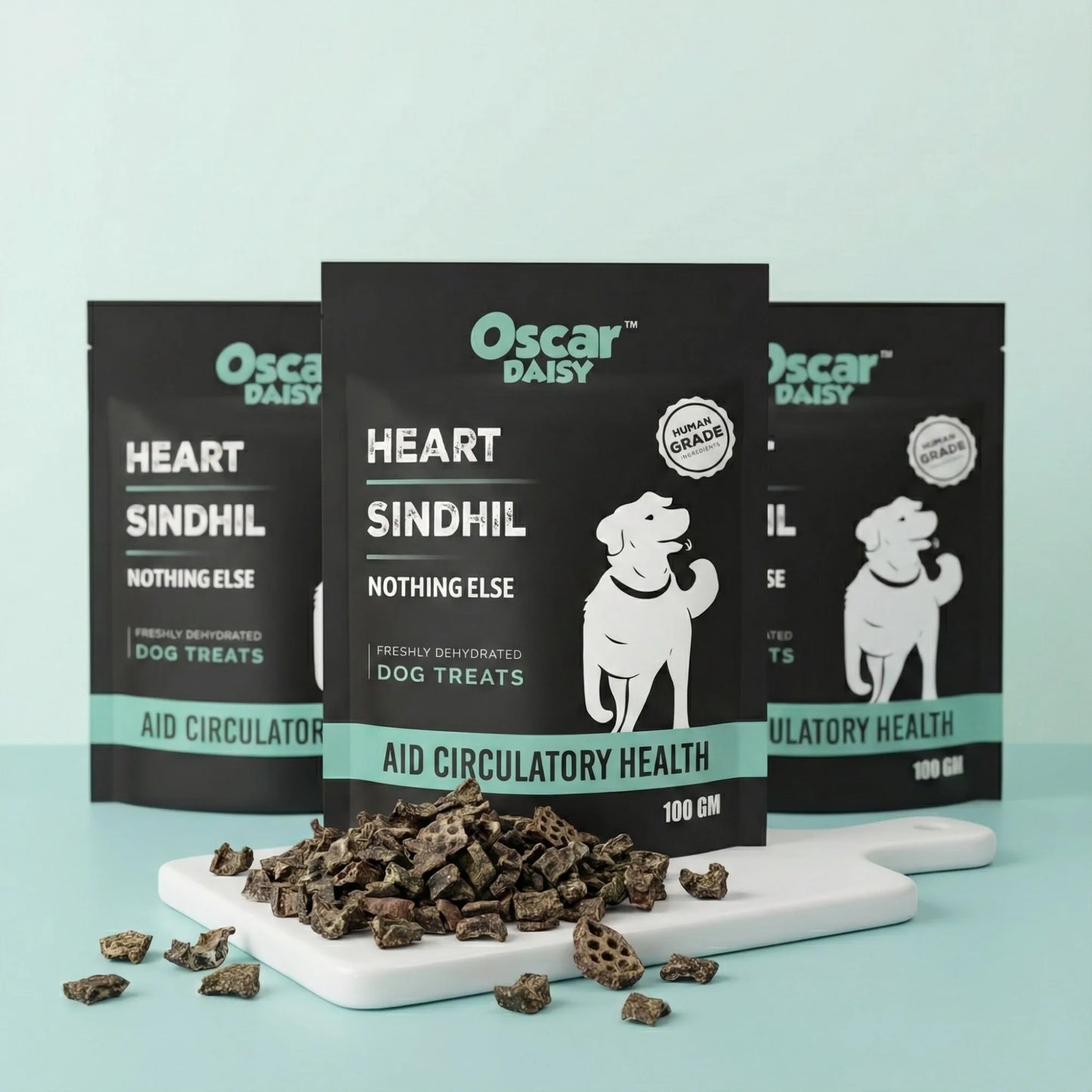 Oscar Daisy dog treats packaging with treats on a white board against a light blue background