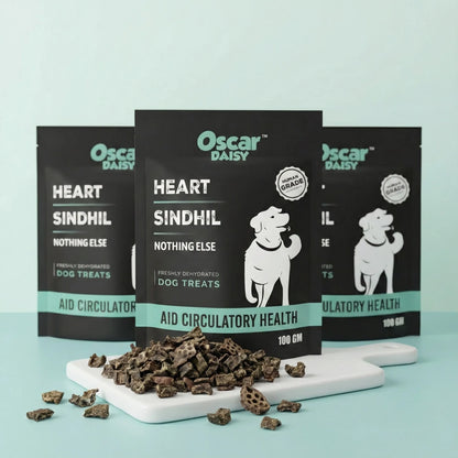 Oscar Daisy dog treats packaging with treats on a white board against a light blue background