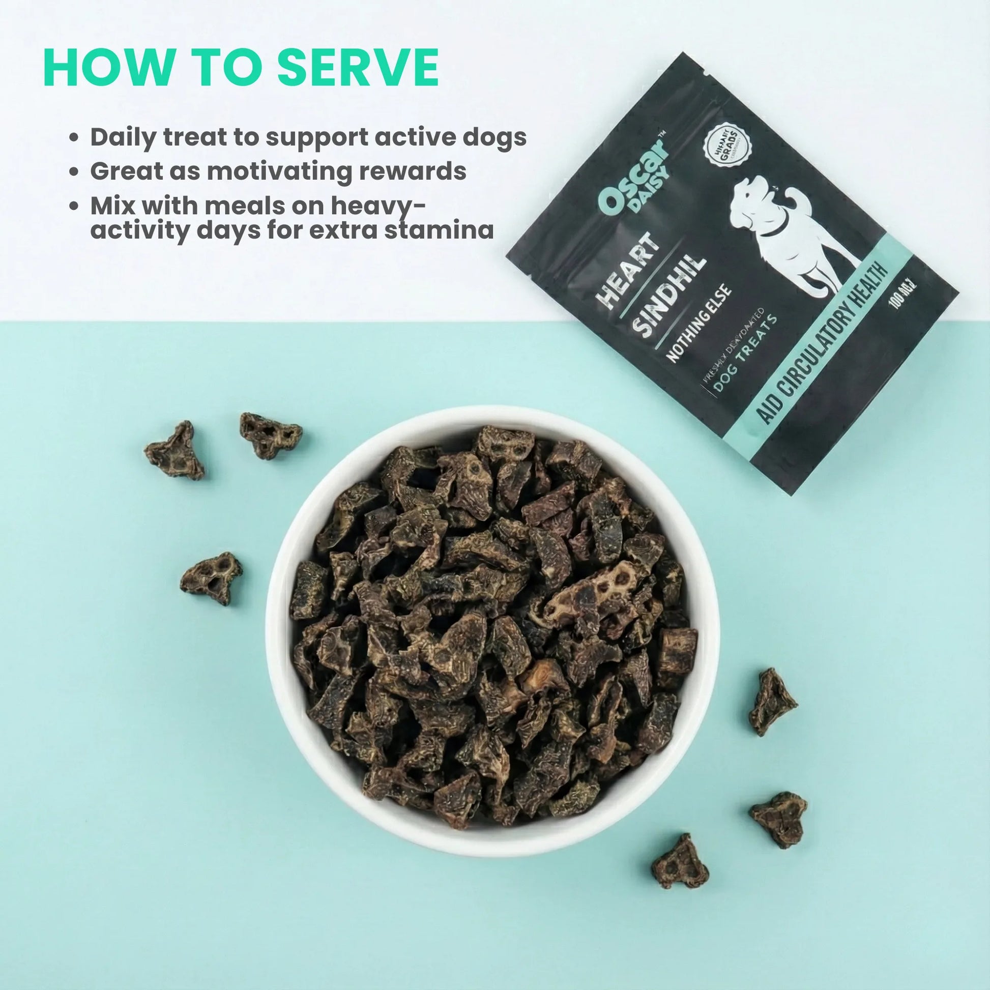 Oscar Daisy Dog treats in a bowl with packaging on a light blue background