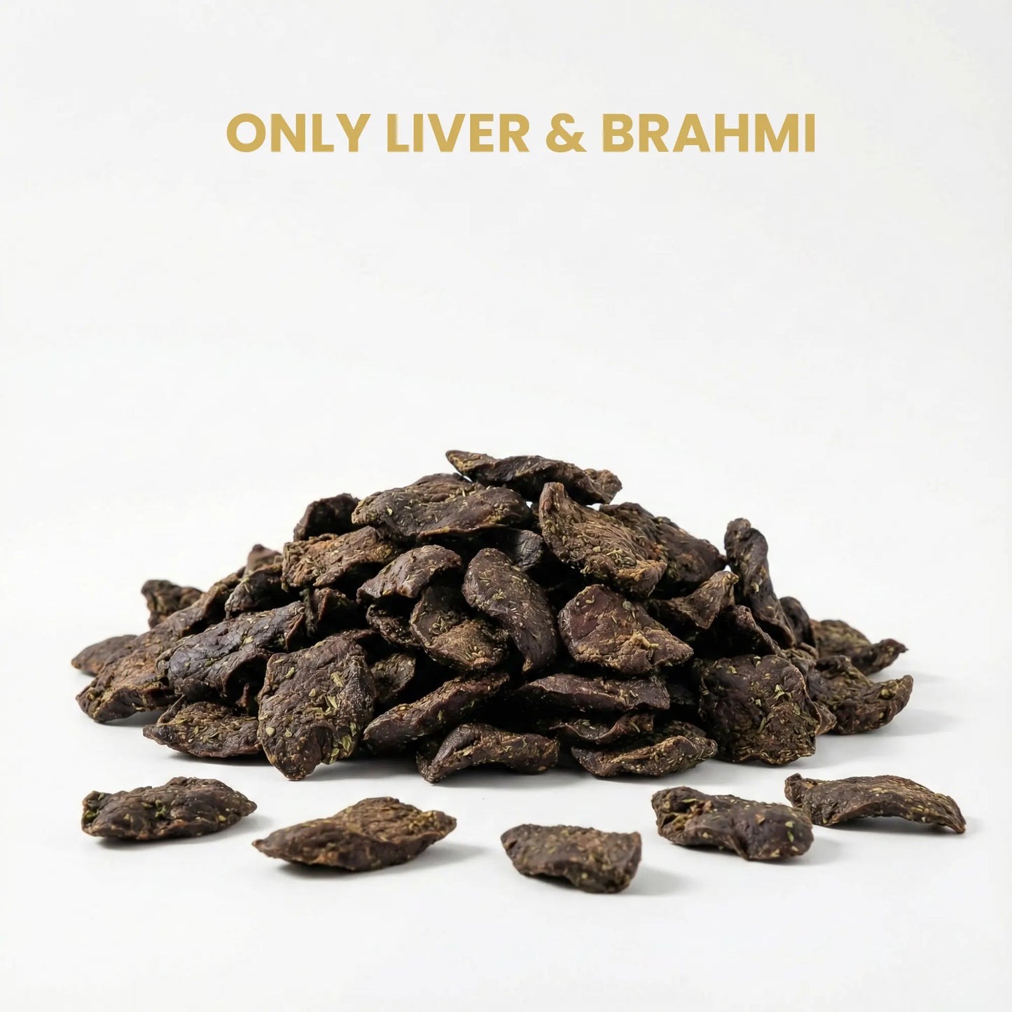Heap of dark brown dog treats labeled 'Only Liver & Brahmi' on a white background
